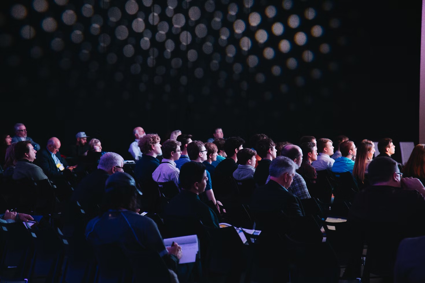 Annual General Meeting with crowd participating in online voting